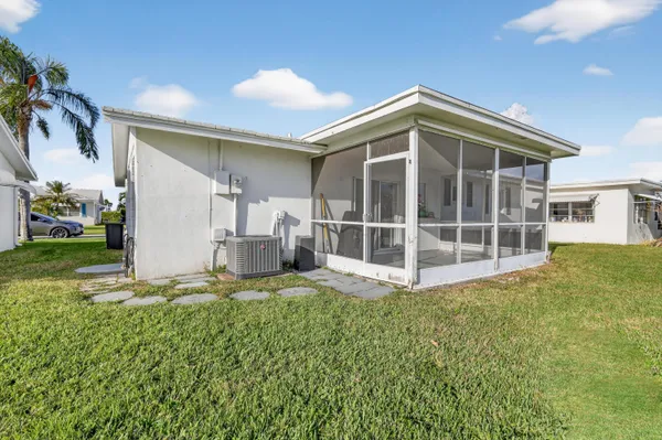 a view of a house with a yard and garage