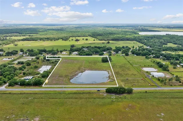 a view of a swimming pool and a yard