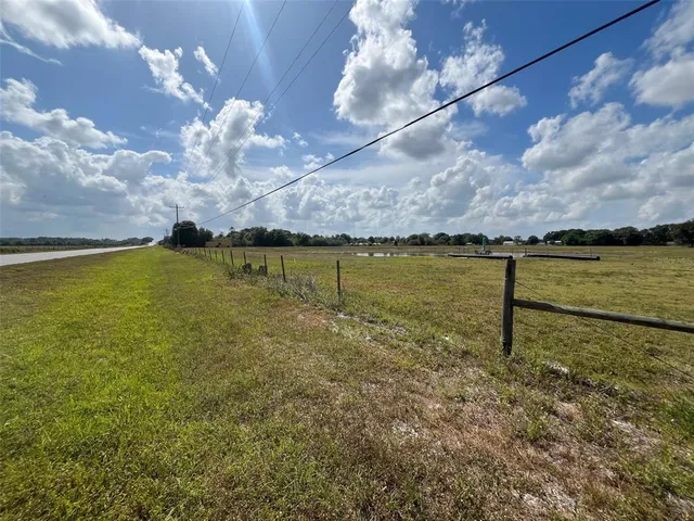 a view of a big yard with a house
