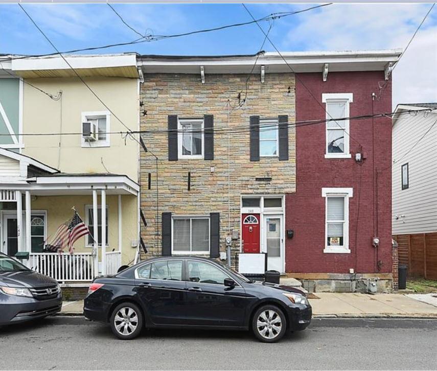 a car parked in front of a building