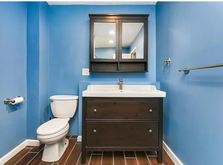 140 Home Street Pittsburgh, PA 15201 - Photo 22 of 25 a bathroom with a toilet a sink and mirror