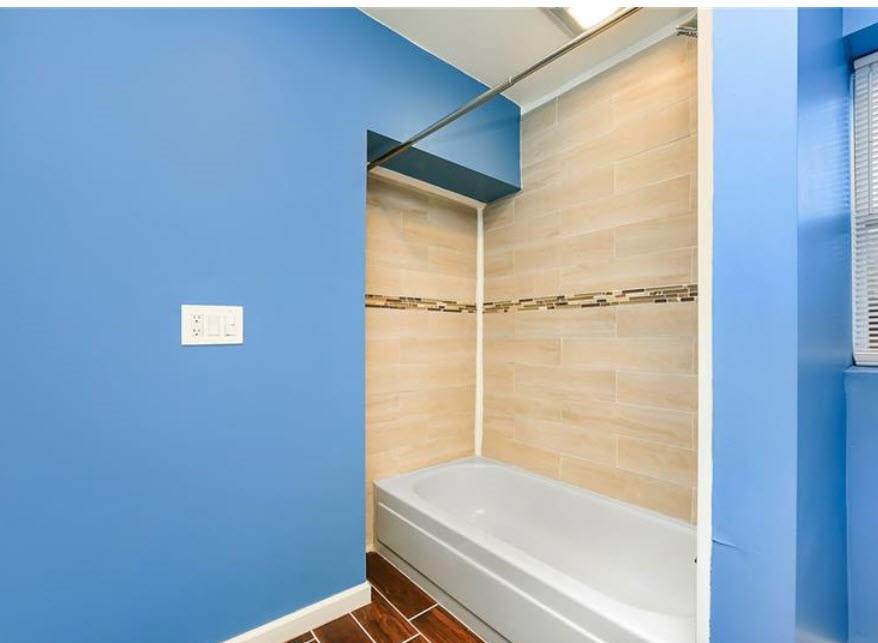 140 Home Street Pittsburgh, PA 15201 - Photo 23 of 25 a bathroom with a bathtub and a shower