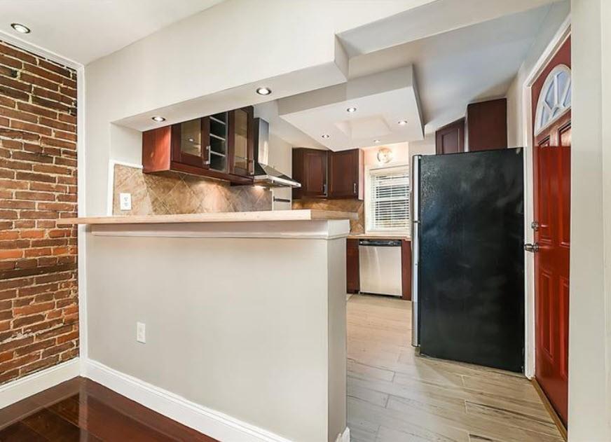 140 Home Street Pittsburgh, PA 15201 - Photo 9 of 25 a kitchen with stainless steel appliances granite countertop a refrigerator and a sink