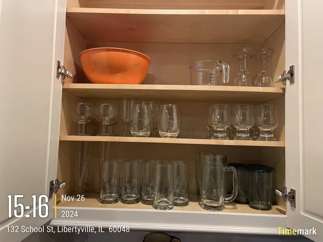a kitchen with a stove and a wooden floor