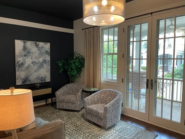 a living room with furniture and a large window