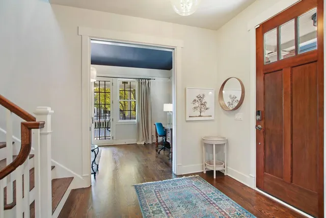 a living room with fireplace furniture and a window