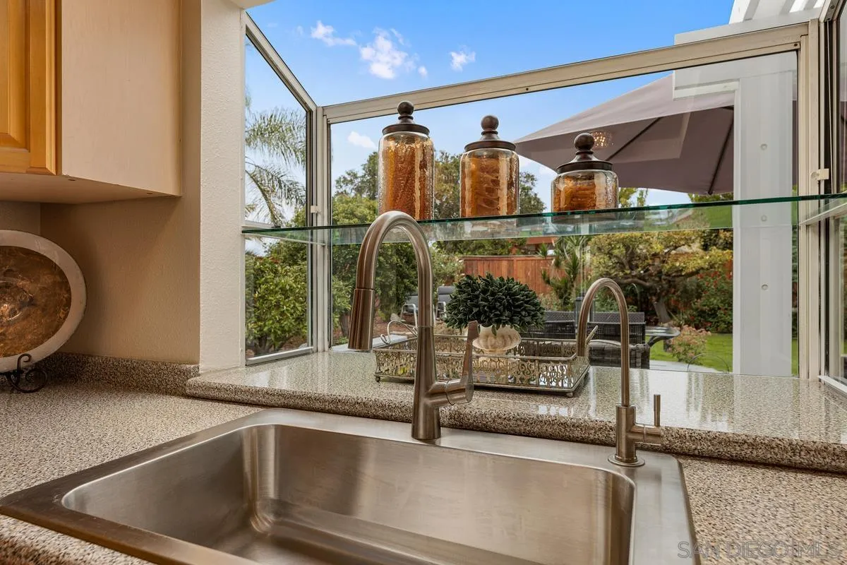505 Willowspring Drive North Encinitas, CA 92024 - Photo 15 of 47 a bathroom with a sink and mirror