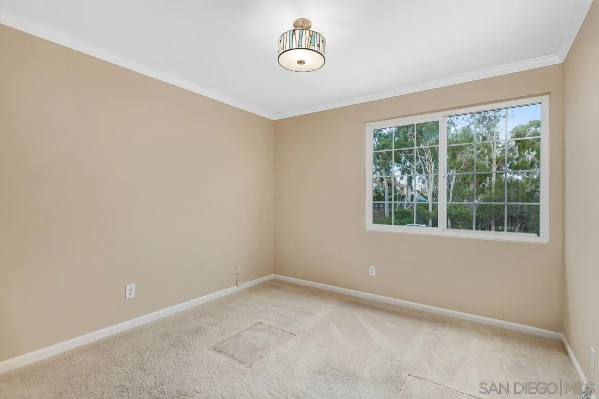 505 Willowspring Drive North Encinitas, CA 92024 - Photo 20 of 47 an empty room with a window