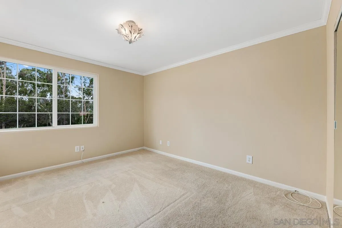505 Willowspring Drive North Encinitas, CA 92024 - Photo 22 of 47 an empty room with a window