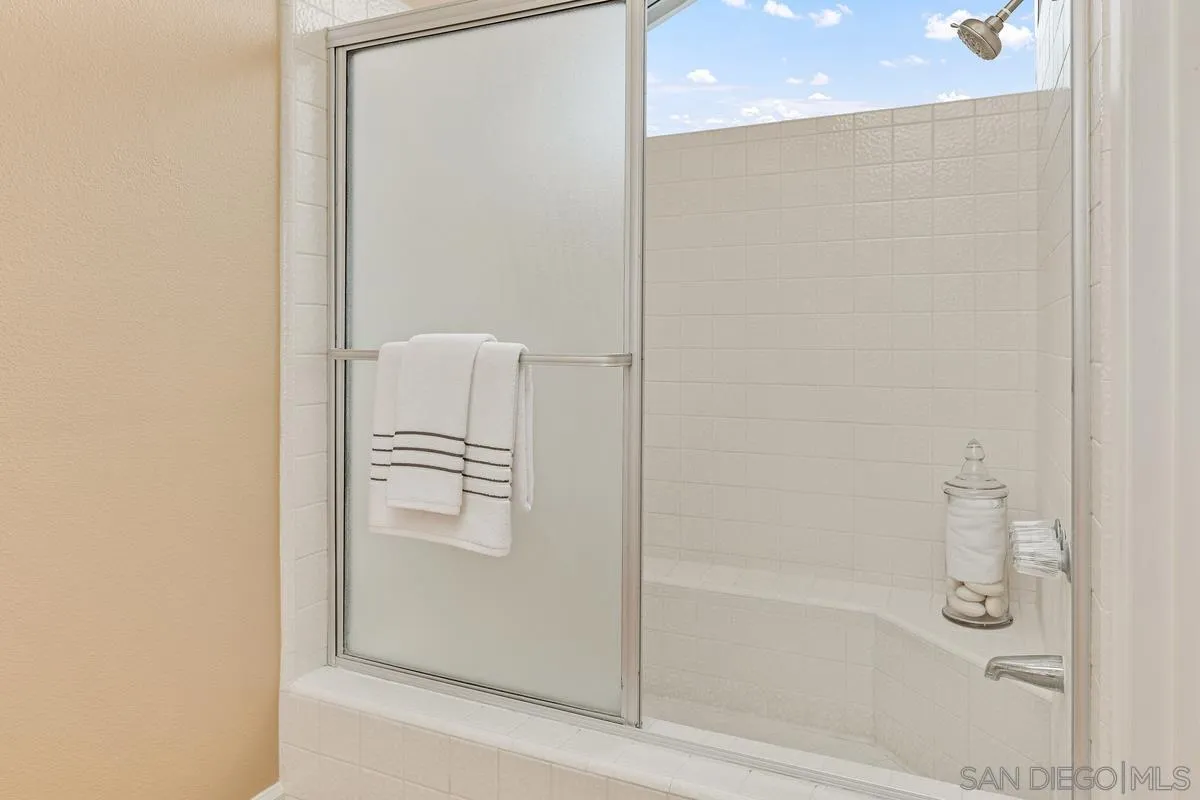 505 Willowspring Drive North Encinitas, CA 92024 - Photo 27 of 47 a bathroom with a glass shower door