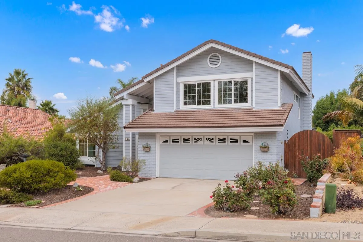 505 Willowspring Drive North Encinitas, CA 92024 - Photo 3 of 47 a front view of a house with a yard and garage