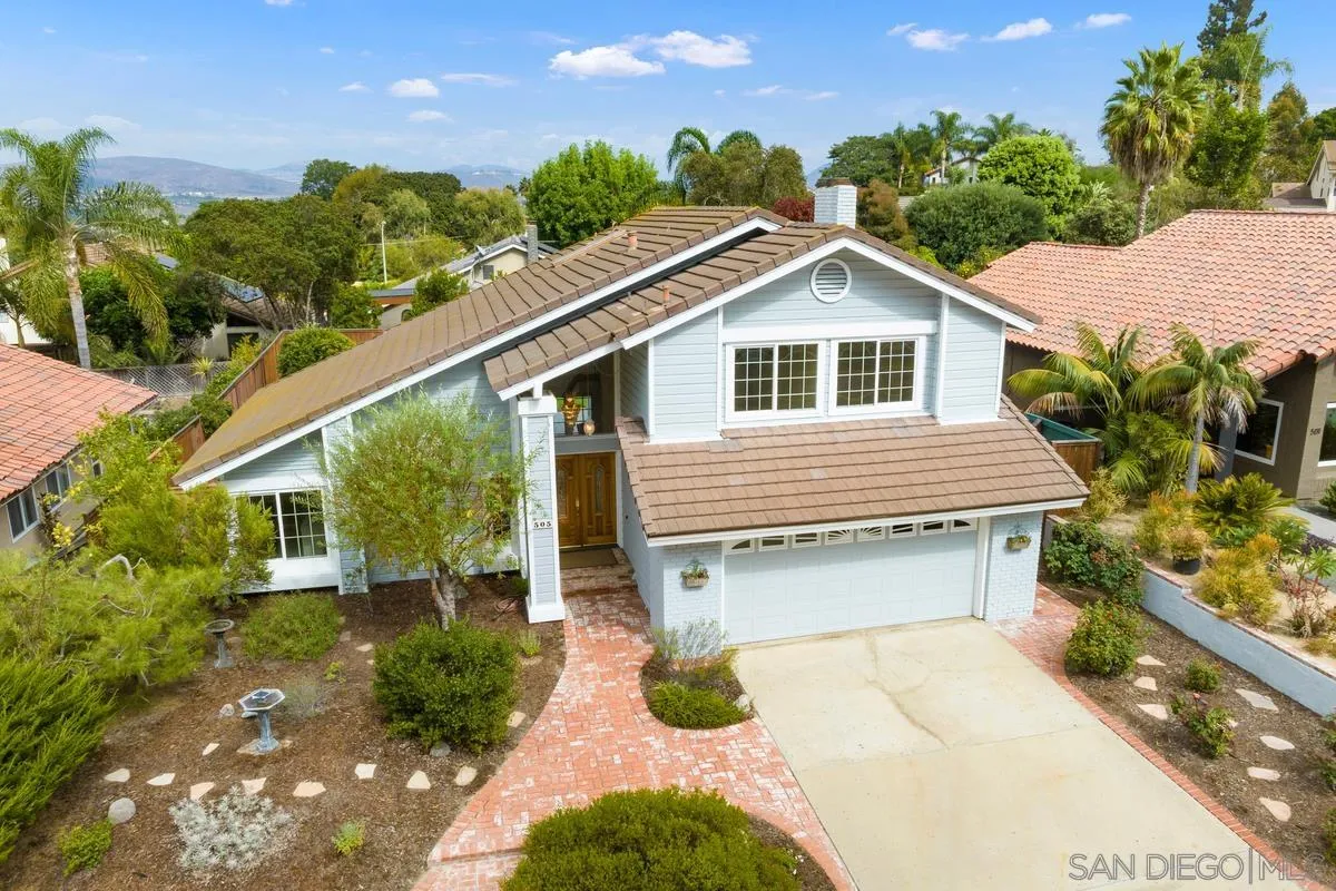505 Willowspring Drive North Encinitas, CA 92024 - Photo 37 of 47 a front view of a house with a garden and plants
