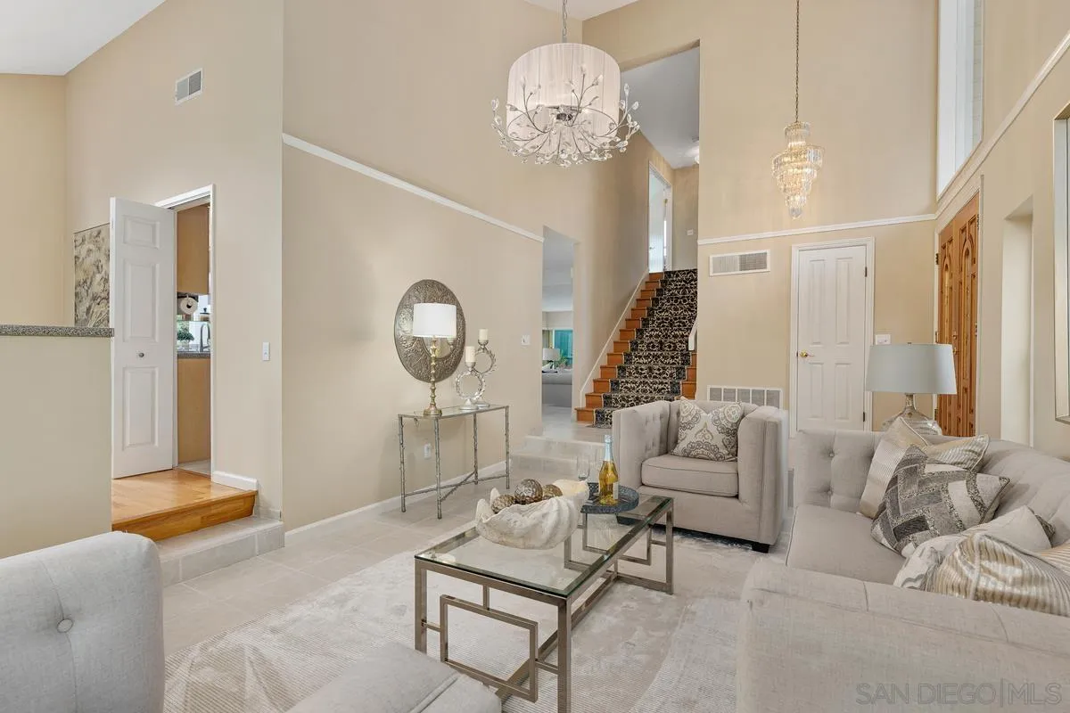 505 Willowspring Drive North Encinitas, CA 92024 - Photo 9 of 47 a living room with furniture chandelier and a mirror