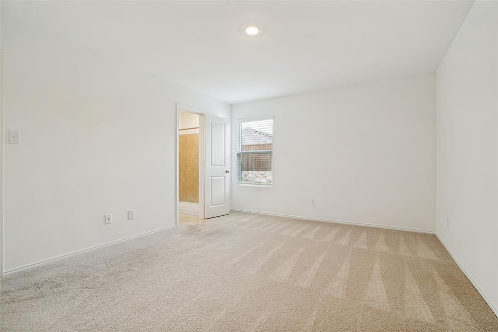 1345 Cider Street Forney, TX 75126 - Photo 8 of 15 an empty room with an entryway
