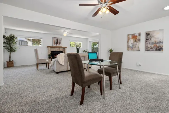 a view of a livingroom with furniture and a potted plant