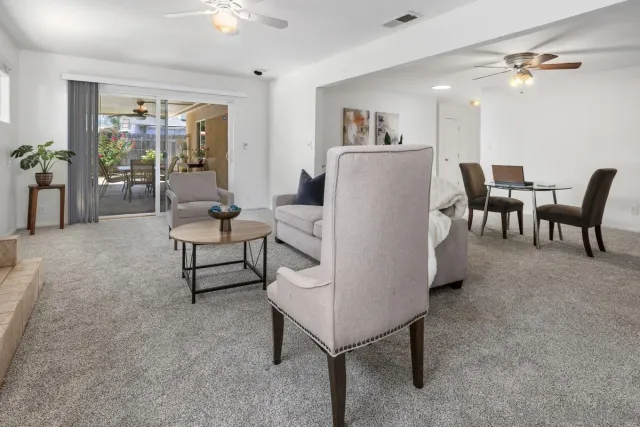 a living room with furniture and a table