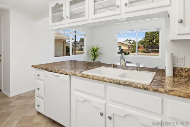 a kitchen with granite countertop a sink and a granite counter tops