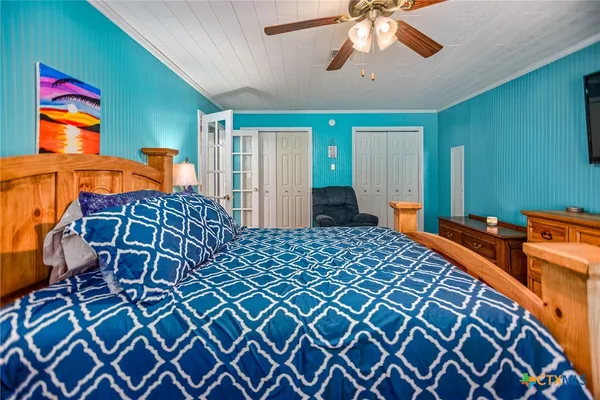 a bedroom with a bed and window