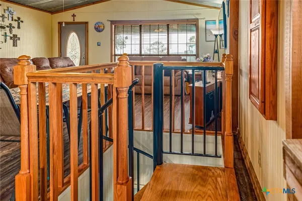a view of staircase with a chair and a porch
