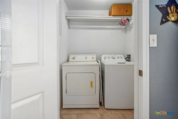 a storage room with washer and dryer