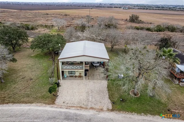 an aerial view of a house with outdoor space