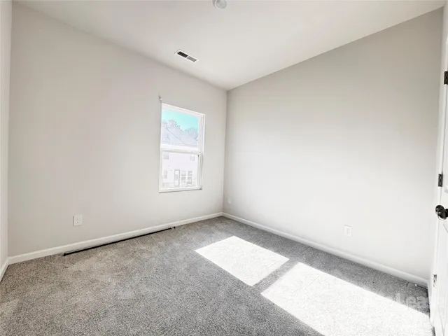 wooden floor in an empty room with stairs