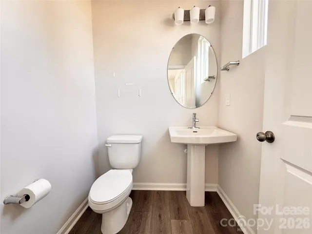 an empty room with a ceiling fan and a window