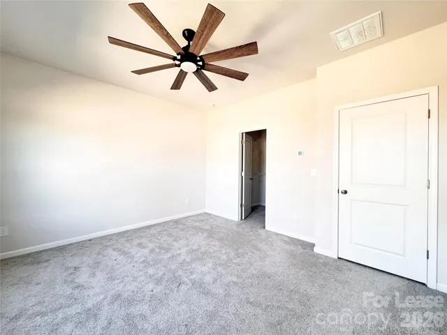 a bathroom with a double vanity sink a toilet and a mirror