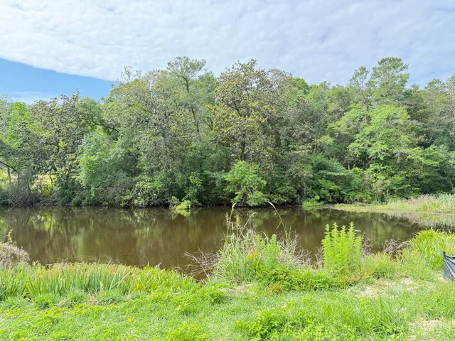 a bathroom with a double vanity sink and mirror