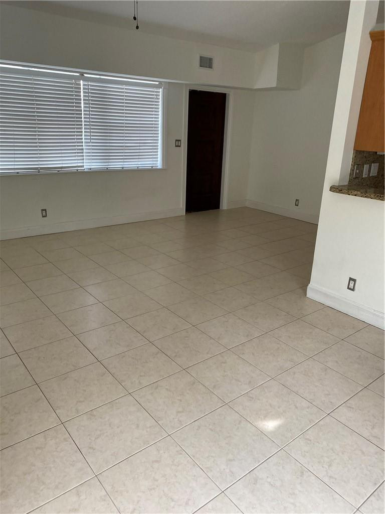 1430 Northeast 4th Court Boca Raton, FL 33432 - Photo 13 of 15 a view of an empty room with a window