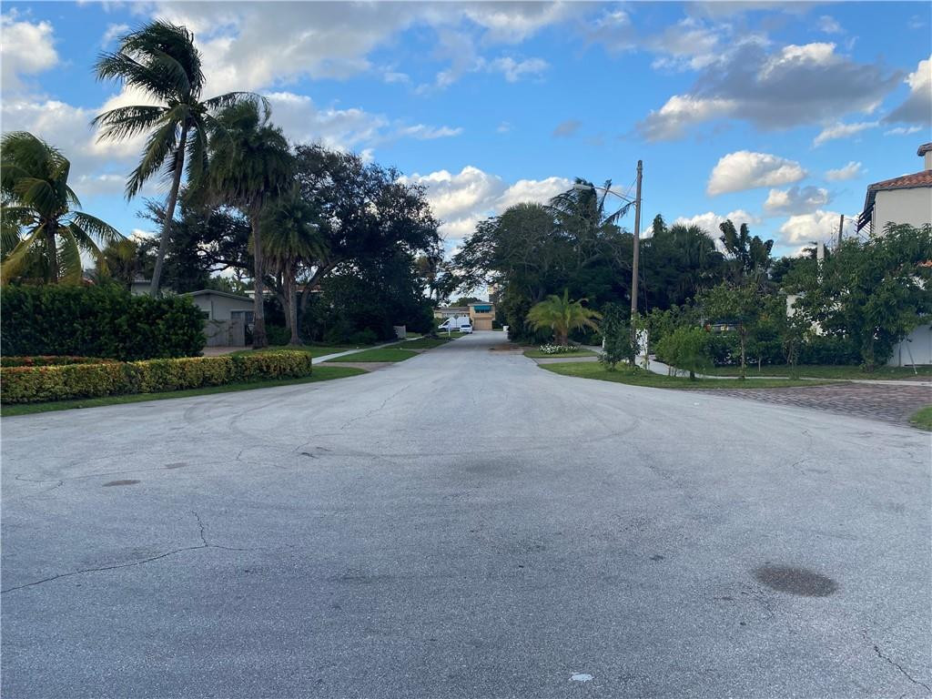 1430 Northeast 4th Court Boca Raton, FL 33432 - Photo 5 of 15 a view of a field with a tree in the background