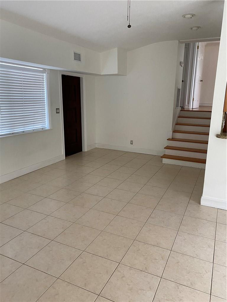 1430 Northeast 4th Court Boca Raton, FL 33432 - Photo 10 of 15 a view of an empty room with stairs