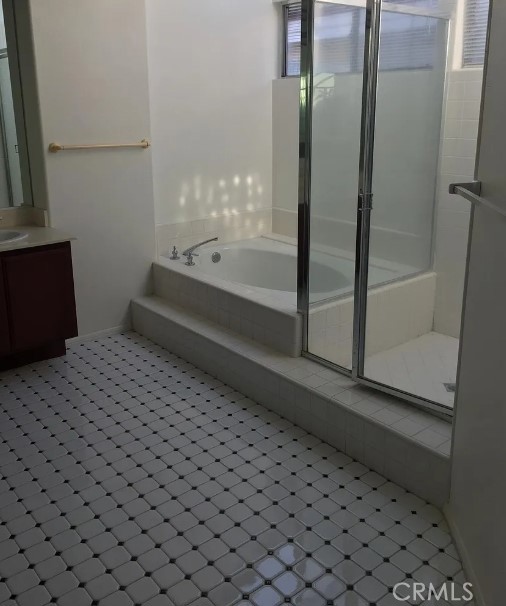 14610 Clearbrook Drive Chino Hills, CA 91709 - Photo 5 of 6 a bathroom with a bathtub and a shower