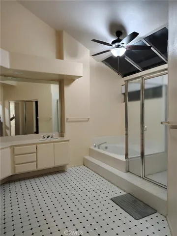 a bathroom with a bathtub and a shower