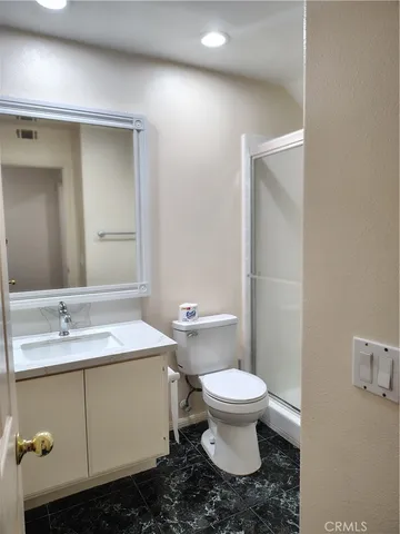 a bathroom with a sink toilet and mirror