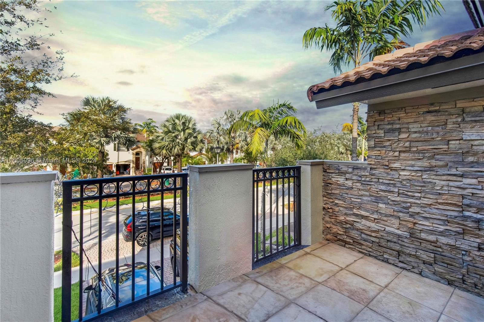 11368 Southwest 238th Street Homestead, FL 33032 - Photo 4 of 18 a side view of a house with balcony