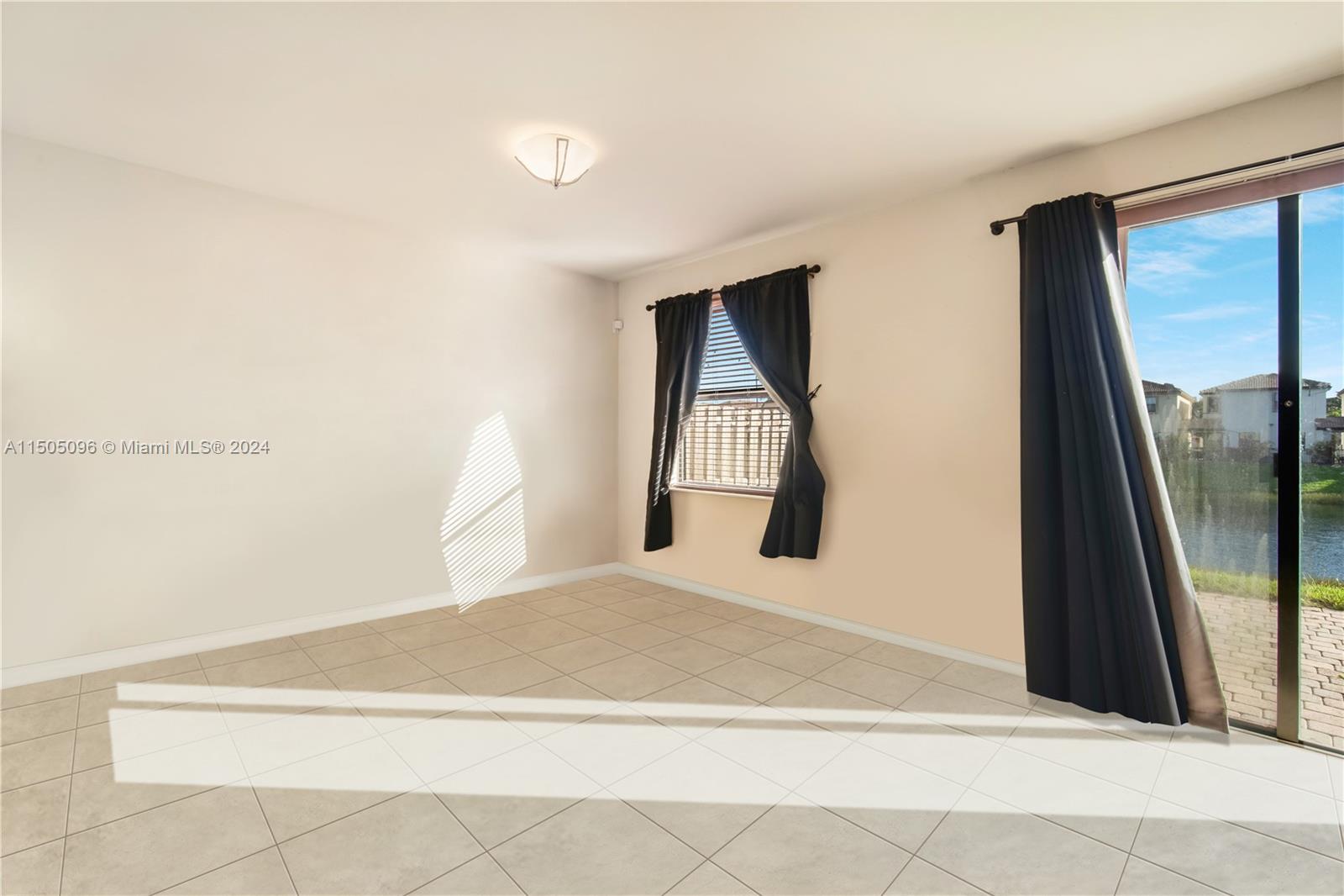 11368 Southwest 238th Street Homestead, FL 33032 - Photo 7 of 18 a bedroom with a bed and a large mirror