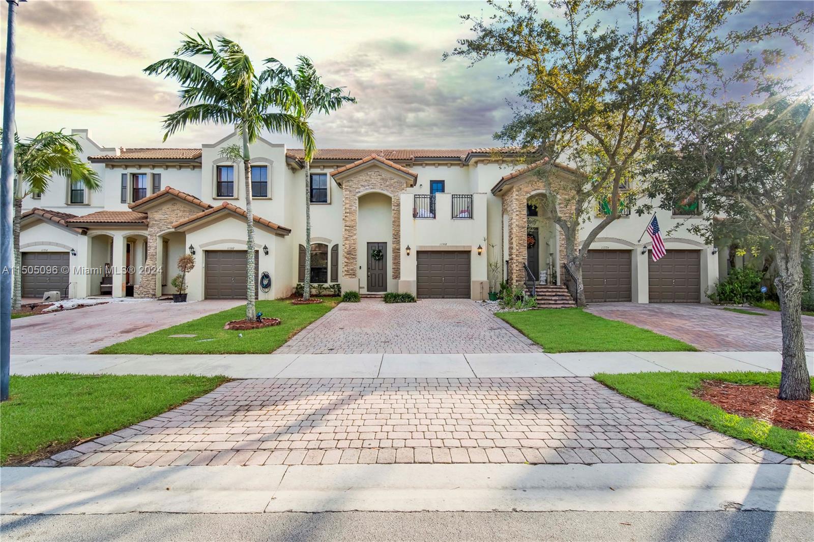 11368 Southwest 238th Street Homestead, FL 33032 - Photo 8 of 18 a front view of a house with a yard and garage