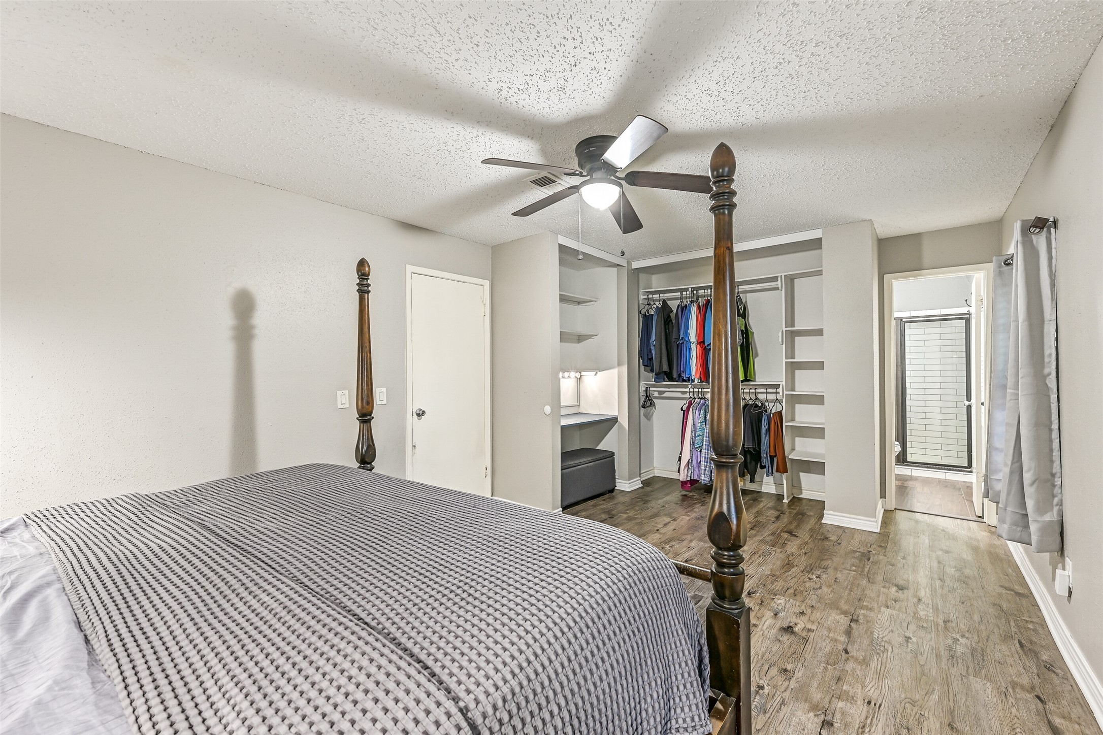 2503 Colleen Drive Pearland, TX 77581 - Photo 13 of 23 a bedroom with a large bed and a chandelier