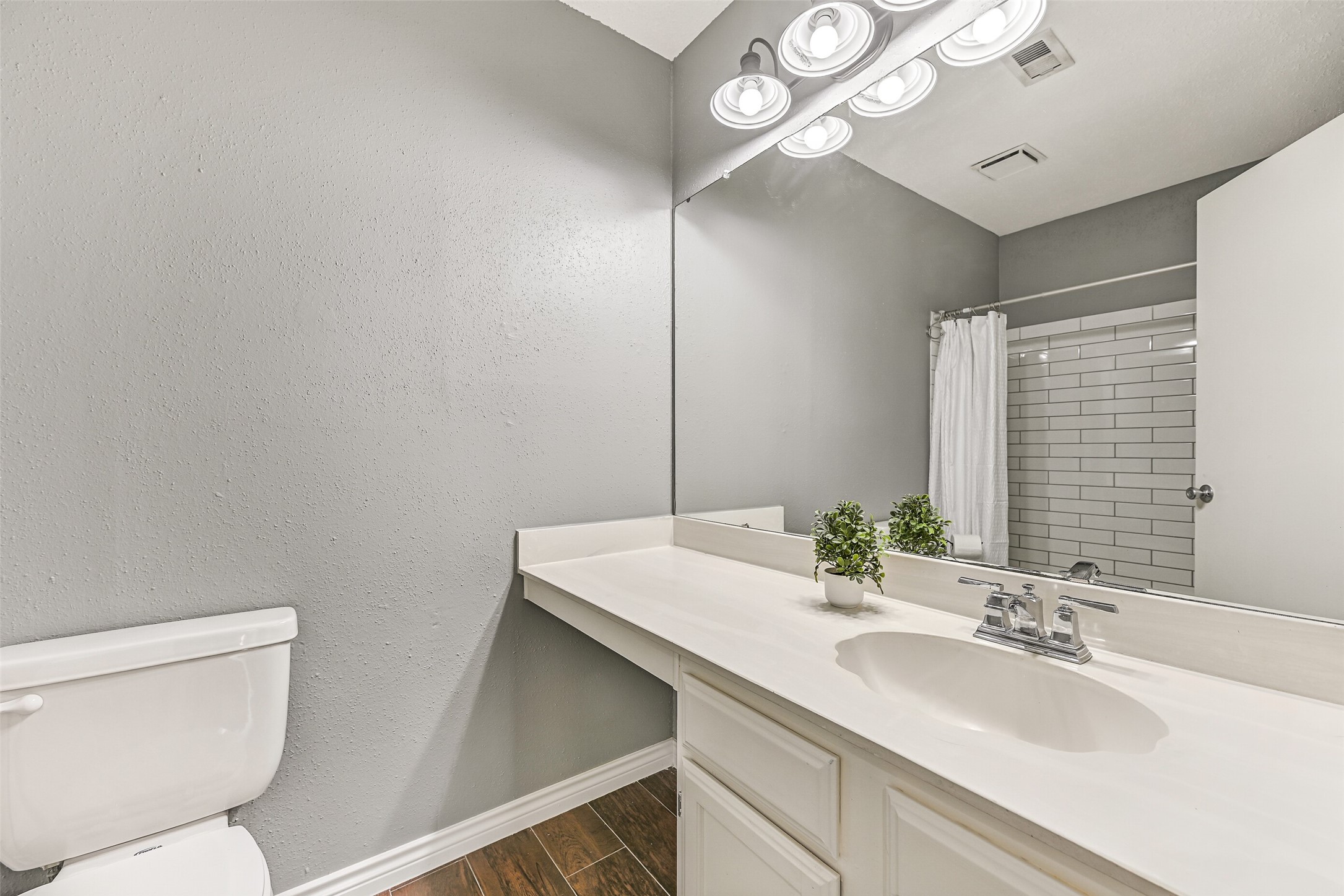 2503 Colleen Drive Pearland, TX 77581 - Photo 16 of 23 a bathroom with a sink a toilet a mirror and vanity