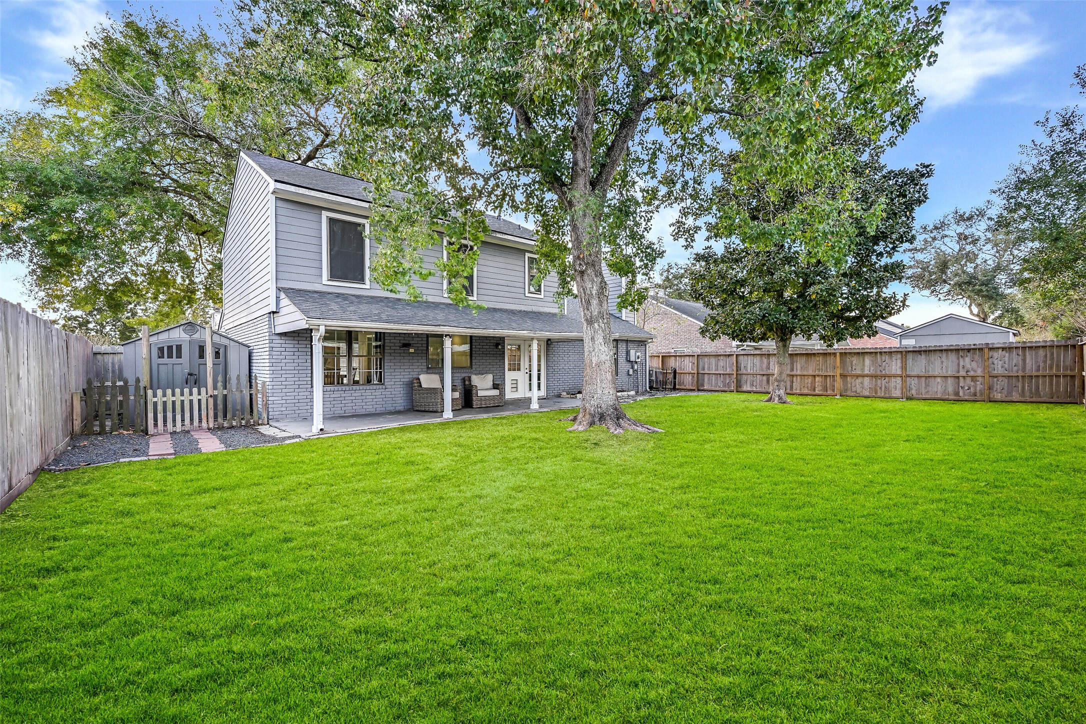2503 Colleen Drive Pearland, TX 77581 - Photo 22 of 23 a front view of a house with a garden