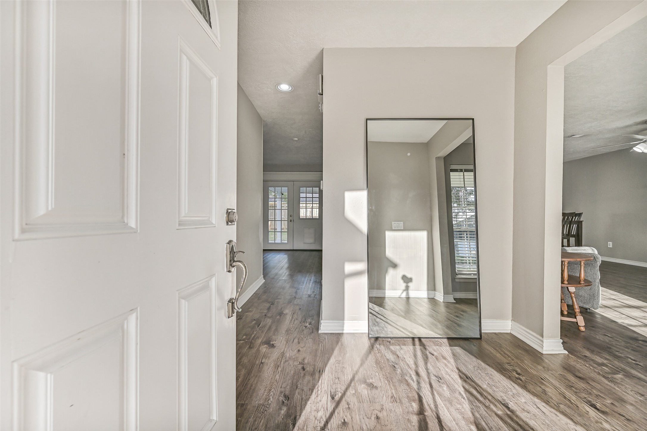 2503 Colleen Drive Pearland, TX 77581 - Photo 3 of 23 a view of a hallway with wooden floor and staircase