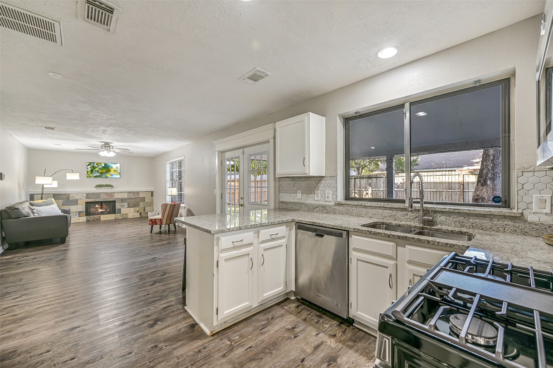2503 Colleen Drive Pearland, TX 77581 - Photo 9 of 23 a kitchen with sink stove and cabinets