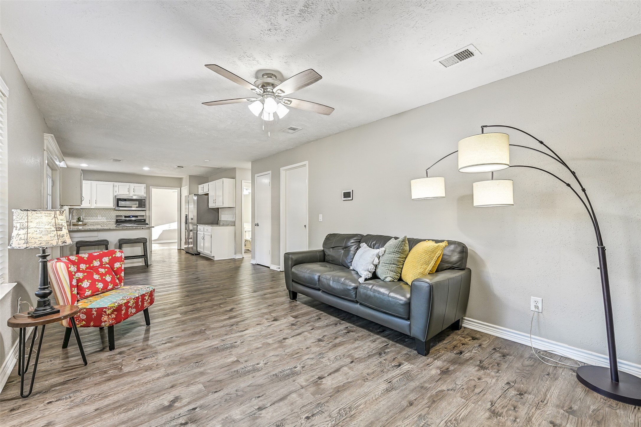 2503 Colleen Drive Pearland, TX 77581 - Photo 10 of 23 a living room with furniture and a chandelier