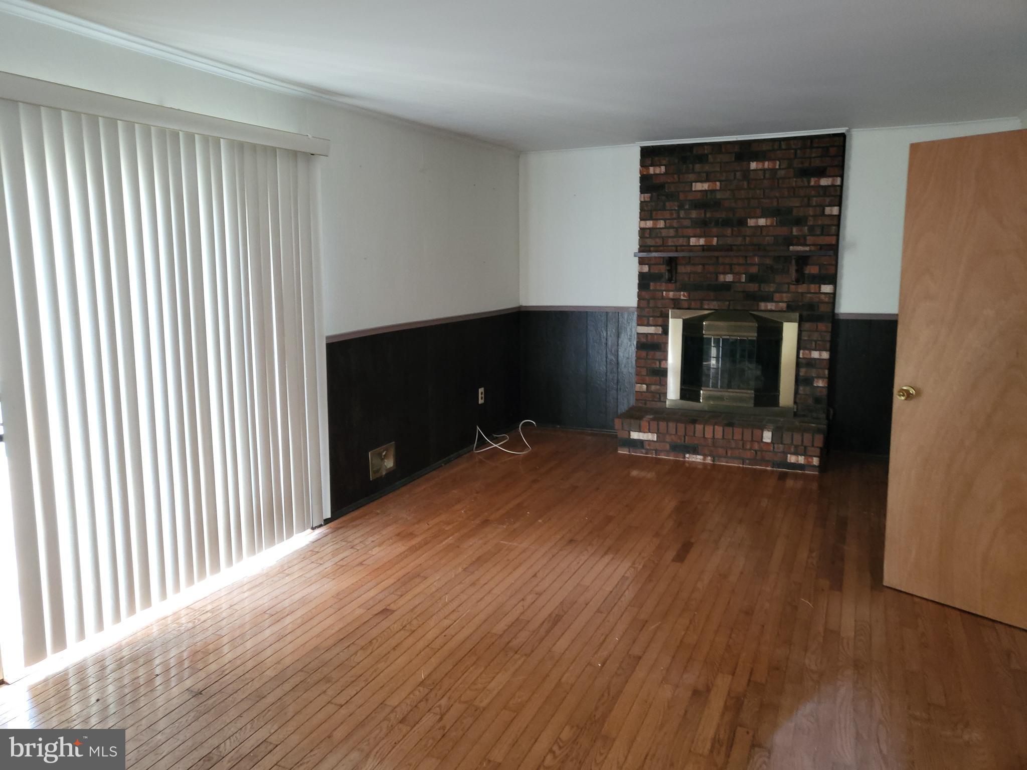 5 Randi Way Titusville, NJ 08560 - Photo 11 of 26 Family room w/f/p, sliding glass door w/ramp