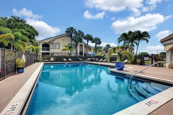 a view of swimming pool with a yard