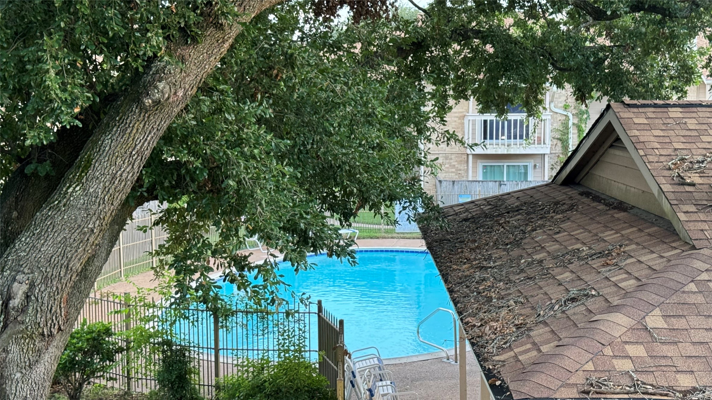 1505 Ward Road, Unit 214 Baytown, TX 77520 - Photo 29 of 33 Balcony view of one of the 2 pools.