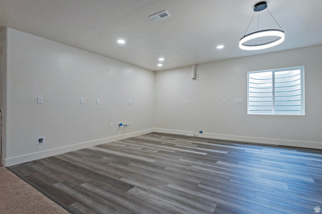 11694 Engelmann Drive Draper, UT 84020 - Photo 37 of 41 Empty room featuring recessed lighting and dark wood finished floors