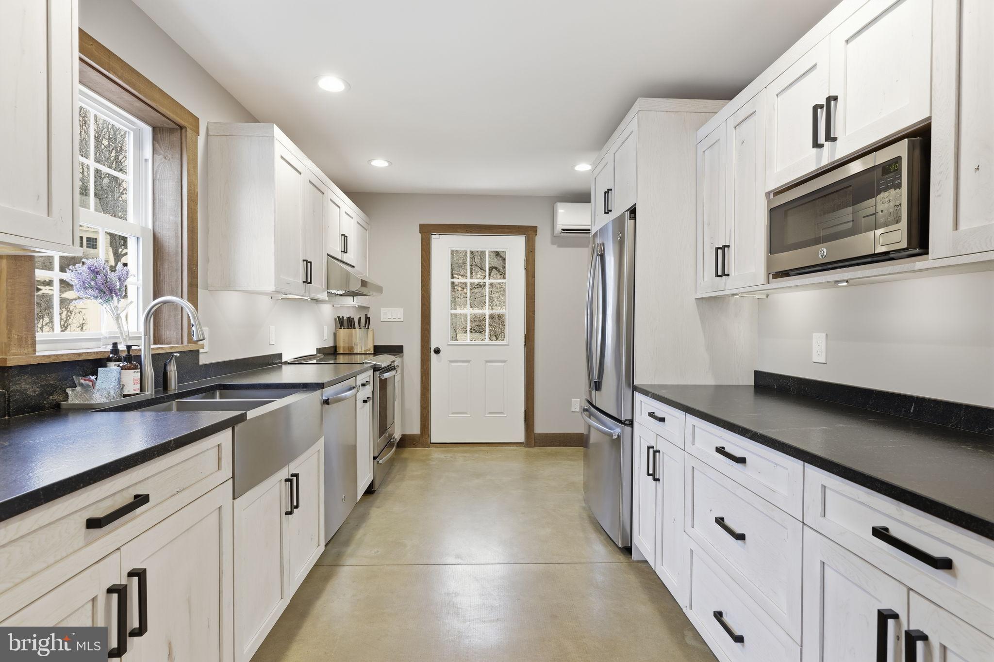 3039 Durham Road Doylestown, PA 18902 - Photo 101 of 122 a large kitchen with stainless steel appliances a sink stove and cabinets