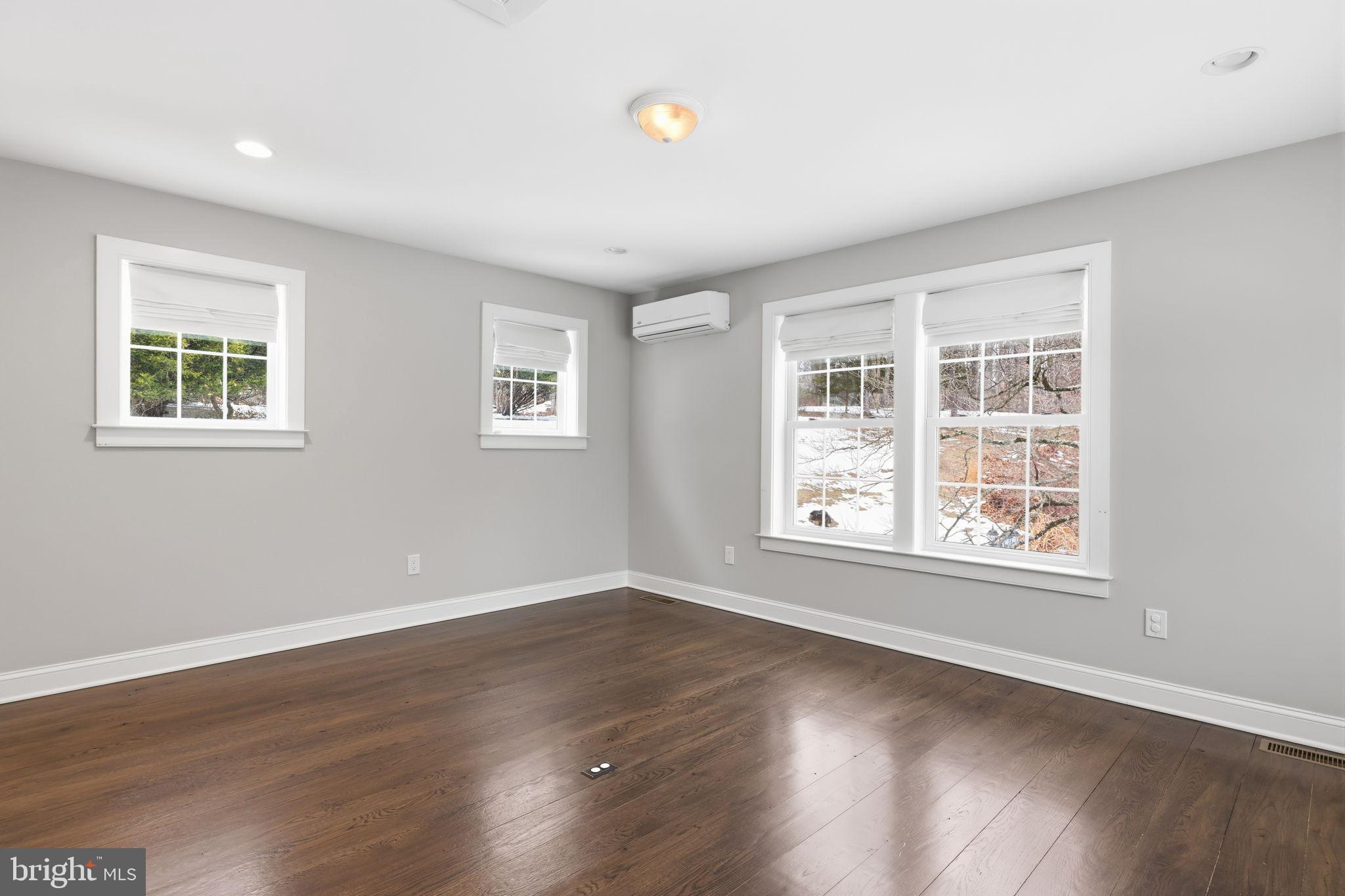 3039 Durham Road Doylestown, PA 18902 - Photo 117 of 122 a view of an empty room with wooden floor and a window